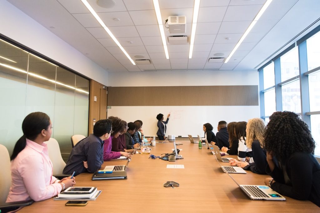 A manager speaking to a team about effective account planning in a conference room.